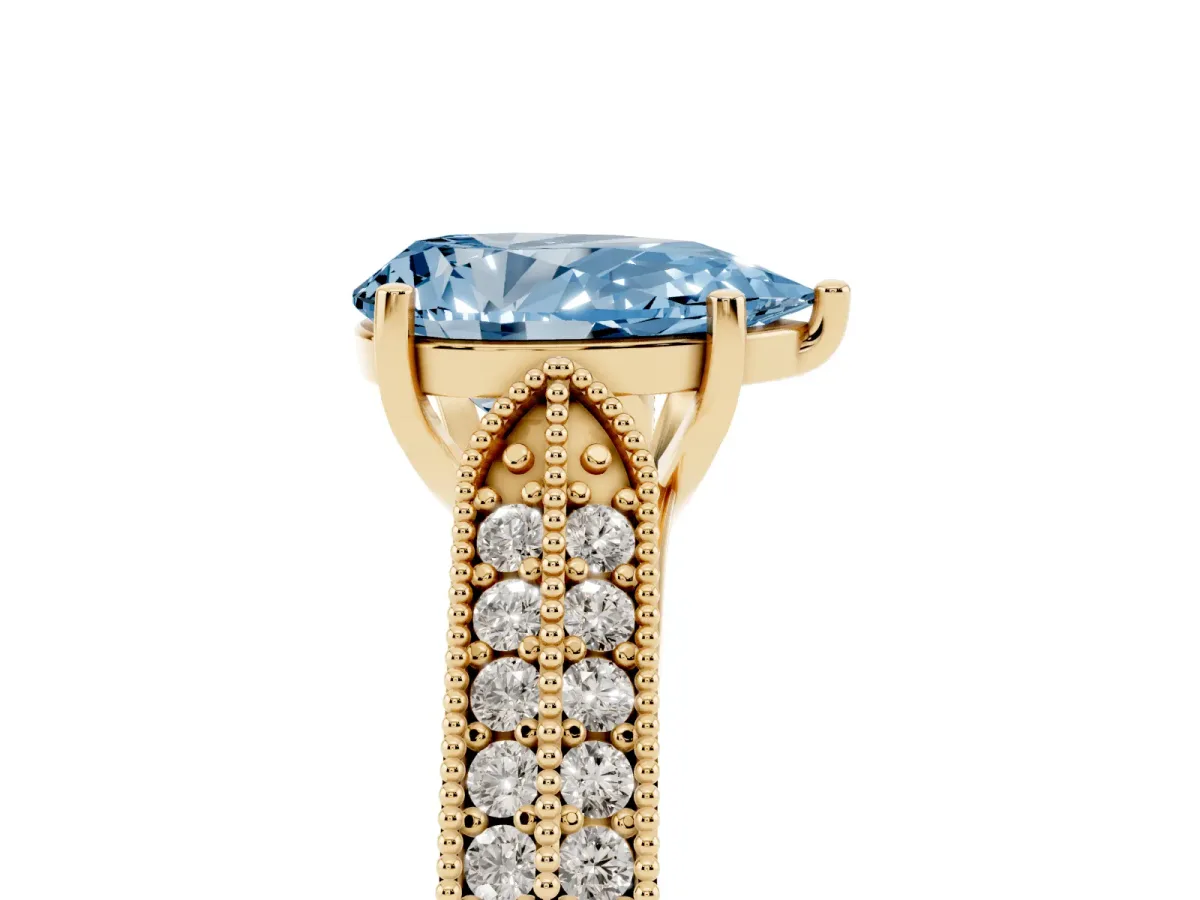 Fancy Blue Pear Cut Cut Pave Split Shank Engagement Ring with Four-Prong Setting Yellow gold