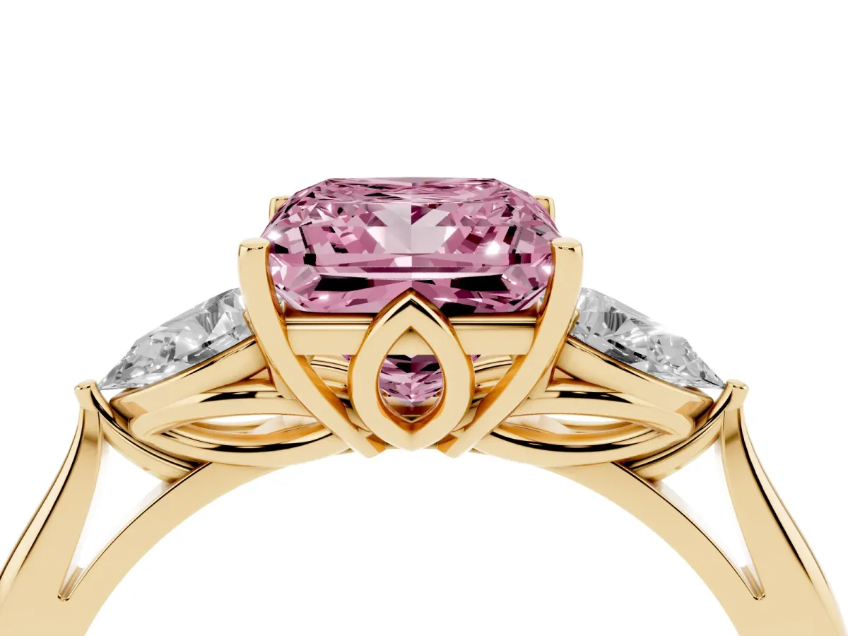 Fancy Pink Three-Stone Princess Cut Diamond Ring with Pear Side Stones in Four-Prong Setting Yellow gold