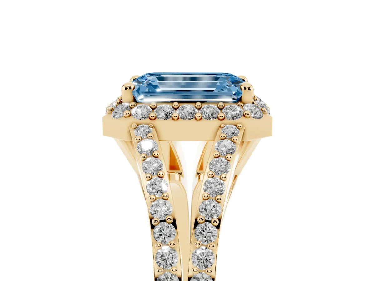 Fancy Blue Emerald Cut Halo Split Shank Pave Diamond Ring with Four-Prong Setting Yellow gold