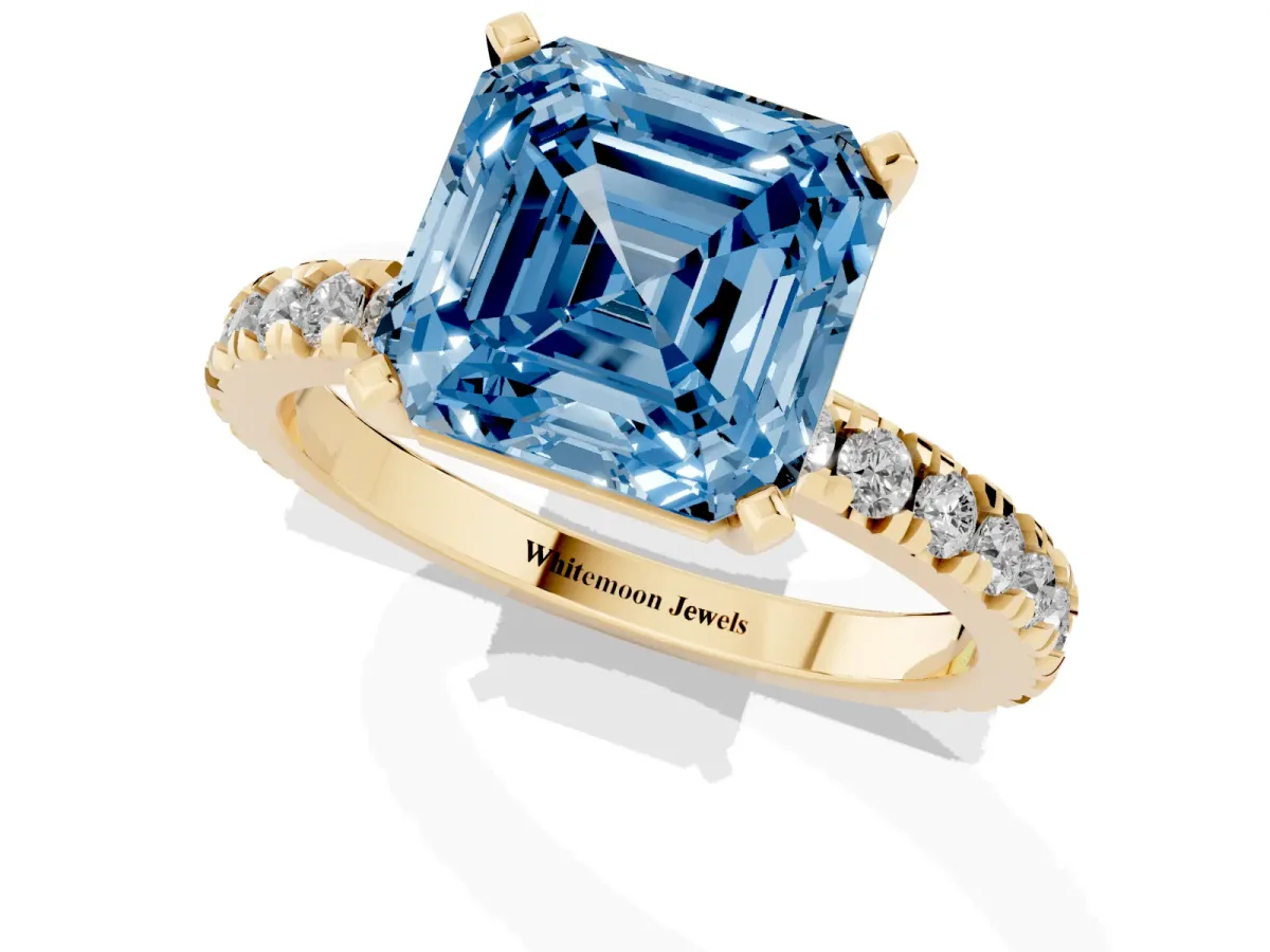 Fancy Blue Asscher Cut Diamond Pavé Band Solitaire with Four-Prong Setting Yellow gold