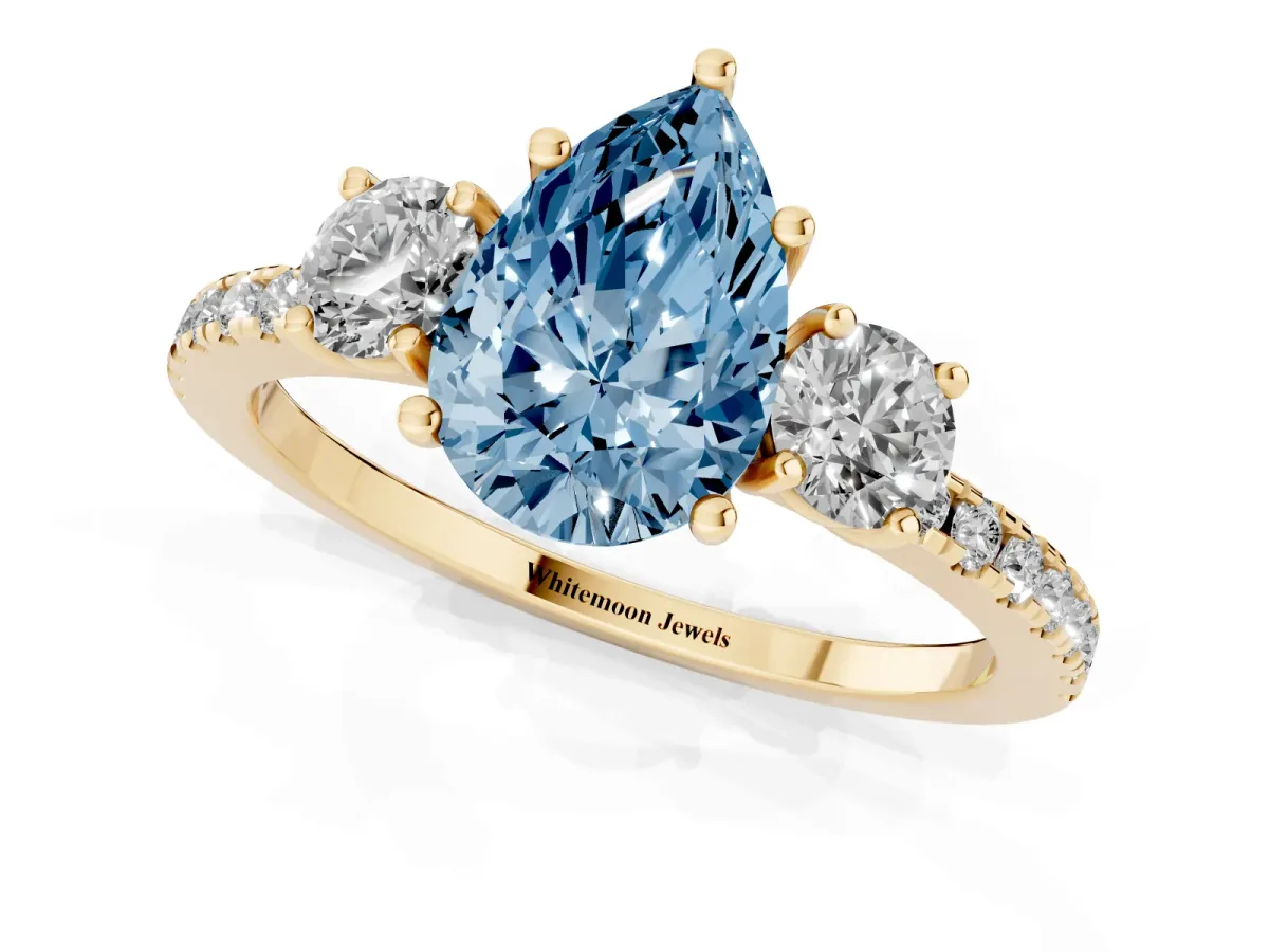 Fancy Blue Three-Stone Pear Cut Cut Diamond Pavé Band with Prong Setting Yellow gold