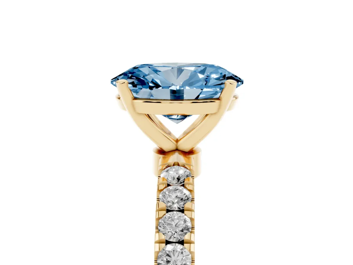 Fancy Blue Oval Cut Diamond Solitaire Ring with Pavé Accents and Four-Prong Setting Yellow gold