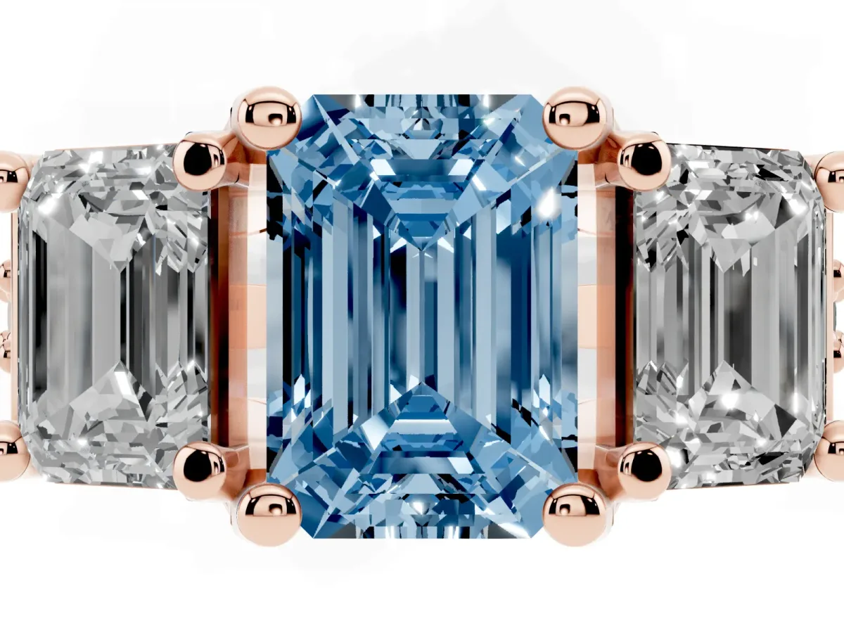 Fancy Blue Emerald Cut Diamond Three-Stone Ring with Channel Set Band and Four-Prong Setting Rose gold