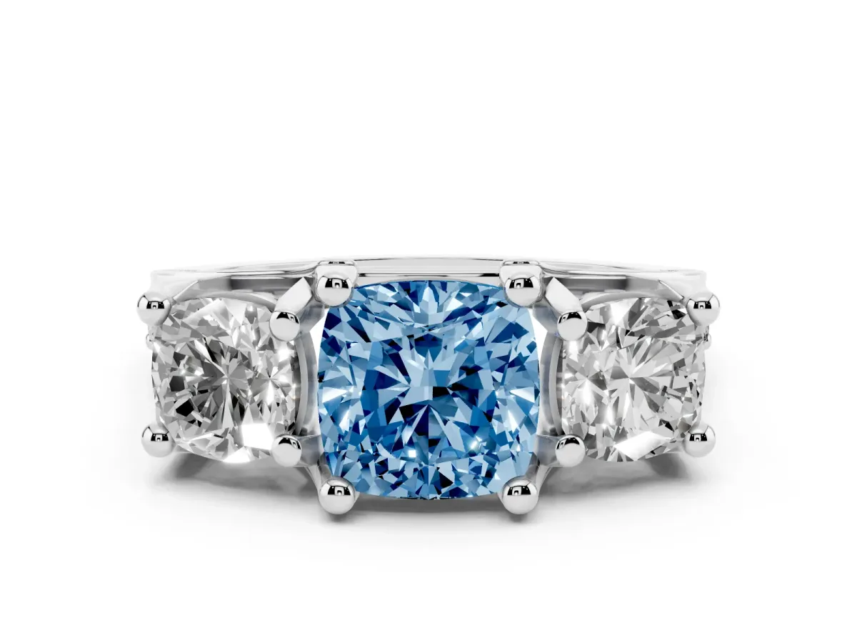Fancy Blue Cushion Cut Diamond Three-Stone Ring with Channel Set Band and Four-Prong Setting White gold