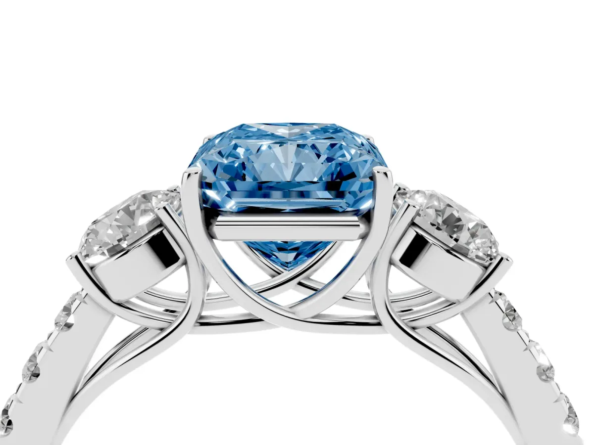 Fancy Blue Radiant Cut Cut Diamond Three-Stone Ring with Round Side Stones and Pavé Band White gold