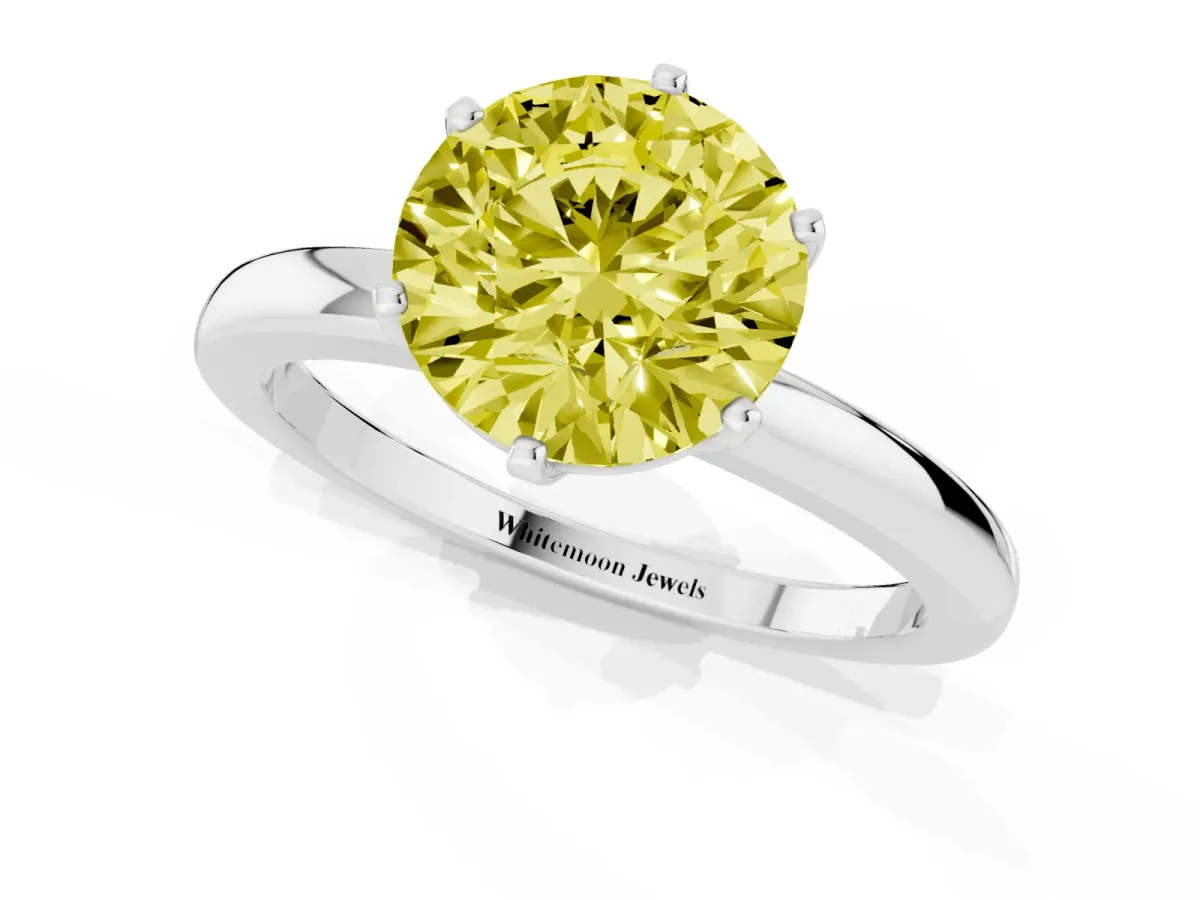 Fancy Yellow Round Cut Solitaire Diamond Ring with Six-Prong Setting on a Classic Band Silver