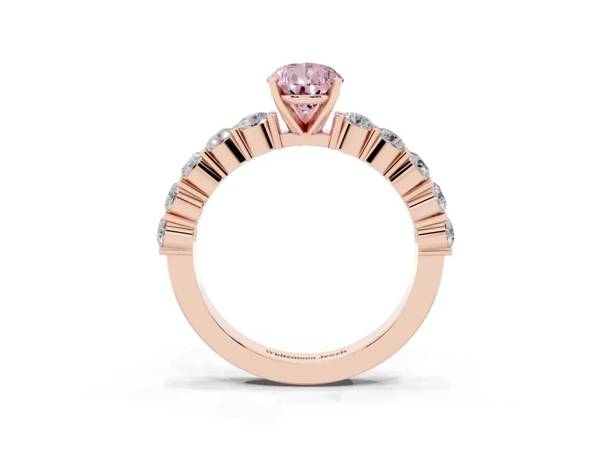 Fancy Pink Pear Cut Diamond Solitaire Ring with Shared Prong Round Side Stones Rose gold