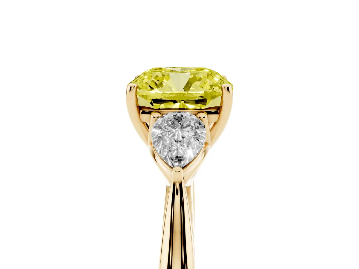 Fancy Yellow Three-Stone Cushion Cut Diamond Ring with Pear Side Stones in Four-Prong Setting Yellow gold