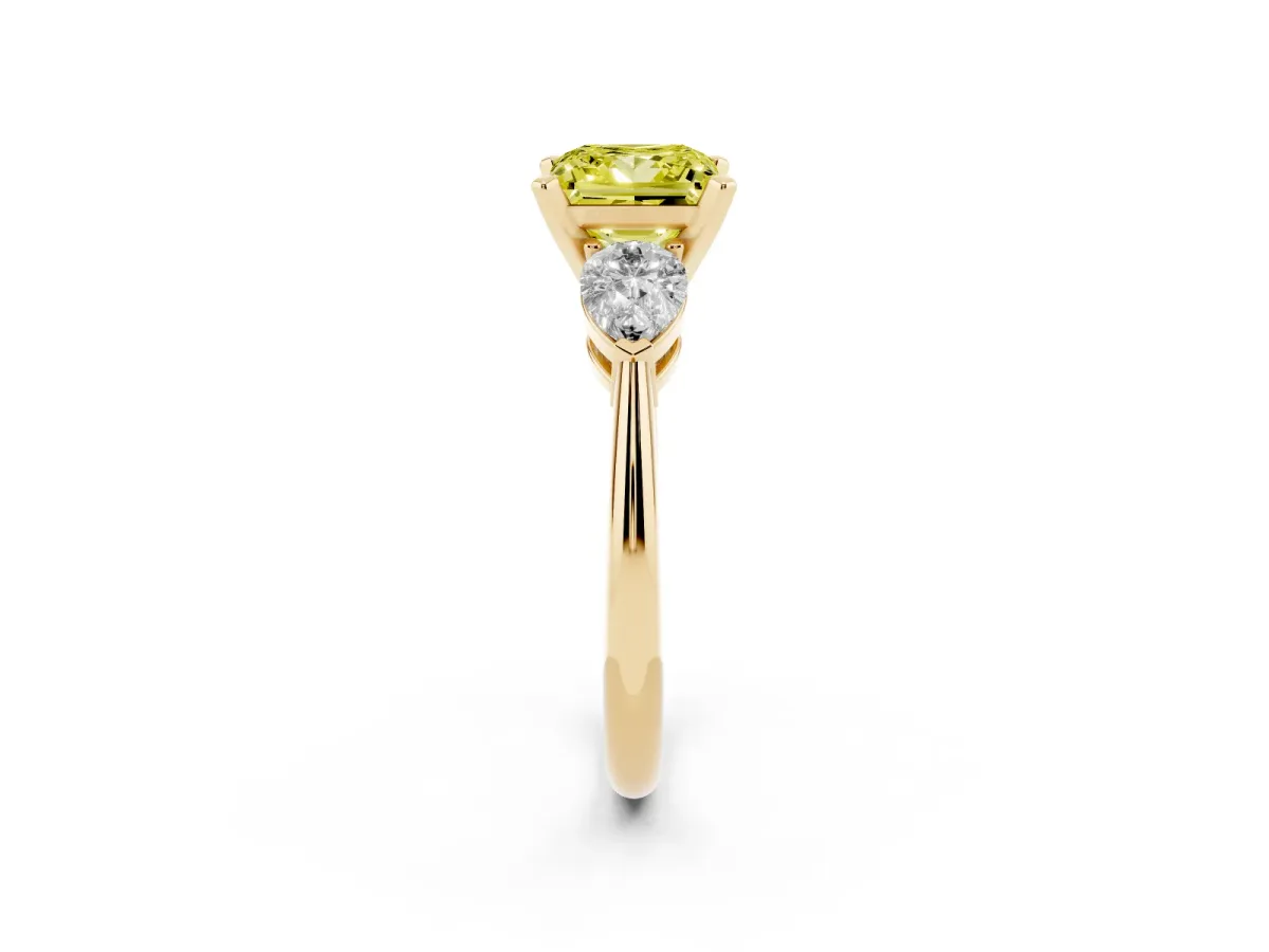 Fancy Yellow Three-Stone Princess Cut Diamond Ring with Pear Side Stones and Four-Prong Setting Yellow gold