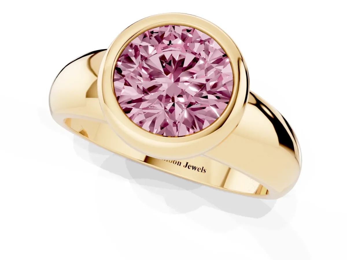 Fancy Pink Bezel Set Round Cut Solitaire Ring with Wide Band Yellow gold