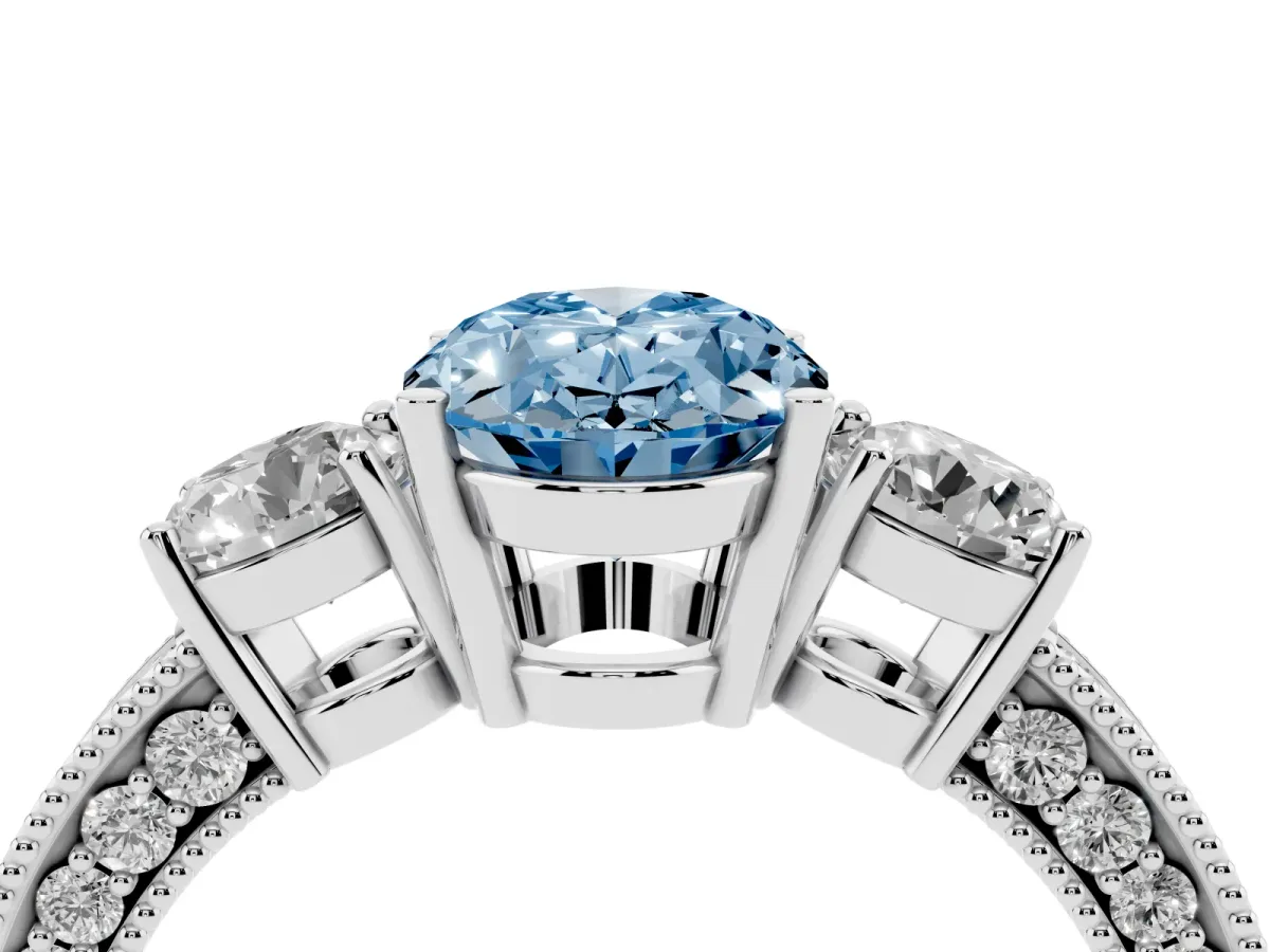 Fancy Blue Oval Cut Three-Stone Diamond Ring with Pavé Band and Four-Prong Setting Platinum