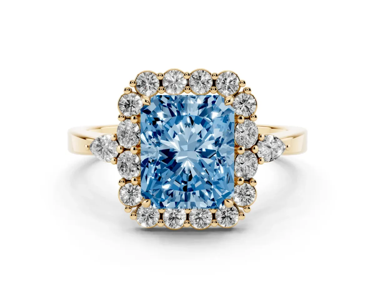 Fancy Blue Radiant Cut Diamond Halo Ring with Pear Side Stones and Prong Setting Yellow gold