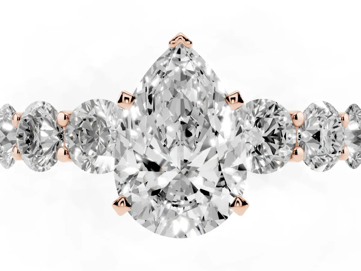 Pear Cut Diamond Prong Setting with Side Stones on a Pave Band Rose gold