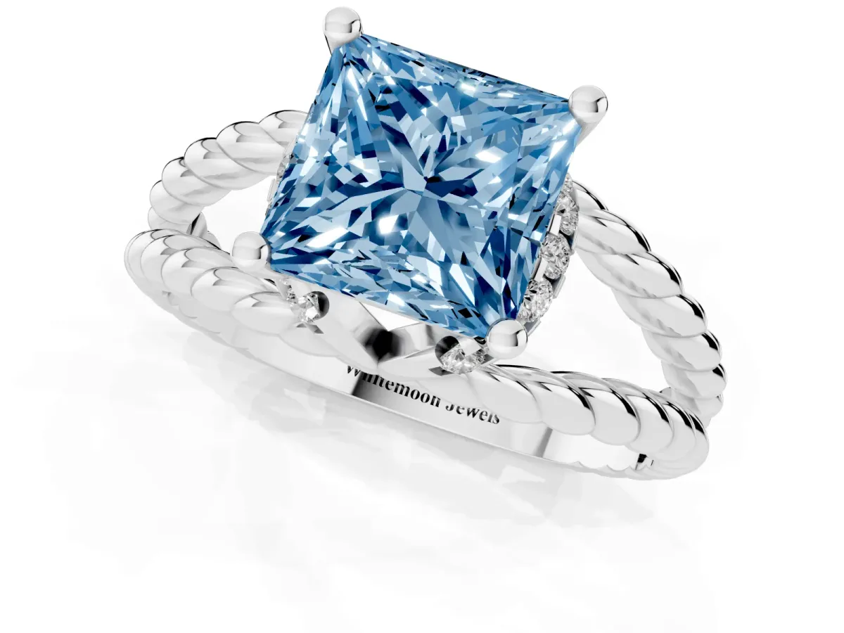 Fancy Blue Princess Cut Halo Twisted Band Four-Prong Ring Silver