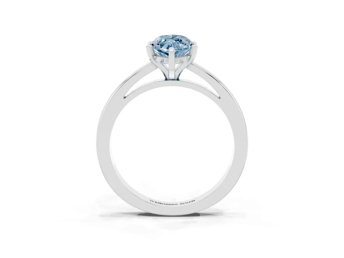 Fancy Blue Marquise Cut Solitaire Diamond Engagement Ring with Four-Prong Setting on a Classic Band Platinum