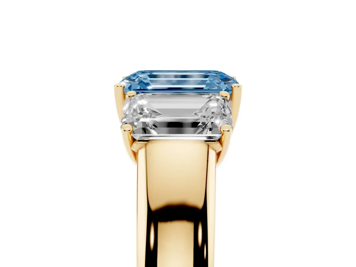 Fancy Blue Three-Stone Emerald Cut Cut Diamond Ring with Prong Setting and Classic Band Yellow gold