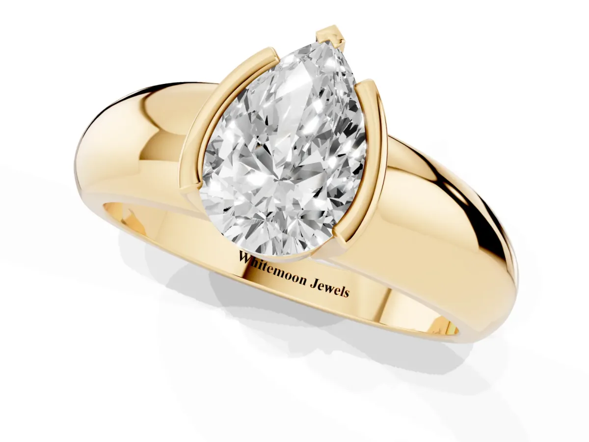 Pear Cut Solitaire Tension Set Diamond Ring with Wide Band Yellow gold