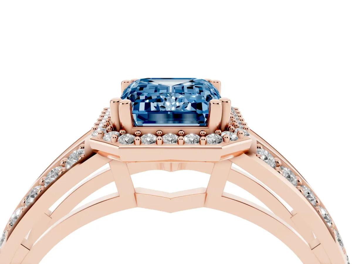 Fancy Blue Emerald Cut Diamond Halo Ring with Split Shank Pavé Band and Four-Prong Setting Rose gold