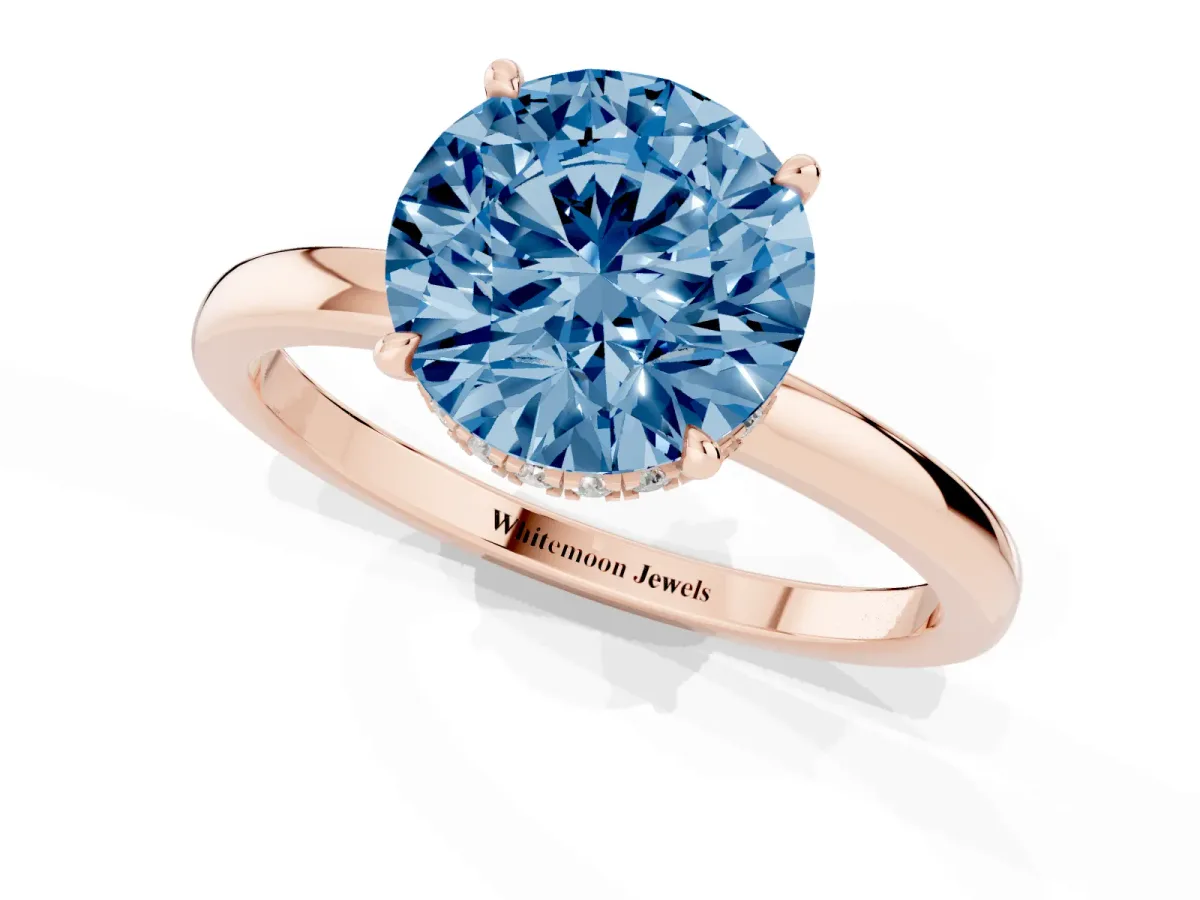 Fancy Blue Round Cut Solitaire Engagement Ring with Cathedral Band and Four-Prong Setting Rose gold