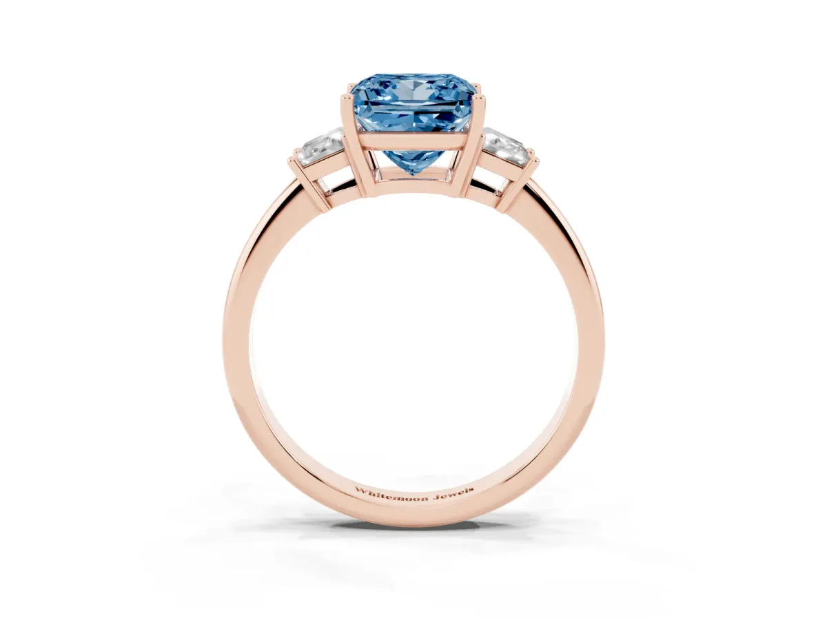 Fancy Blue Princess Cut Diamond Three-Stone Ring with Trapezoid Side Stones and Prong Setting Rose gold