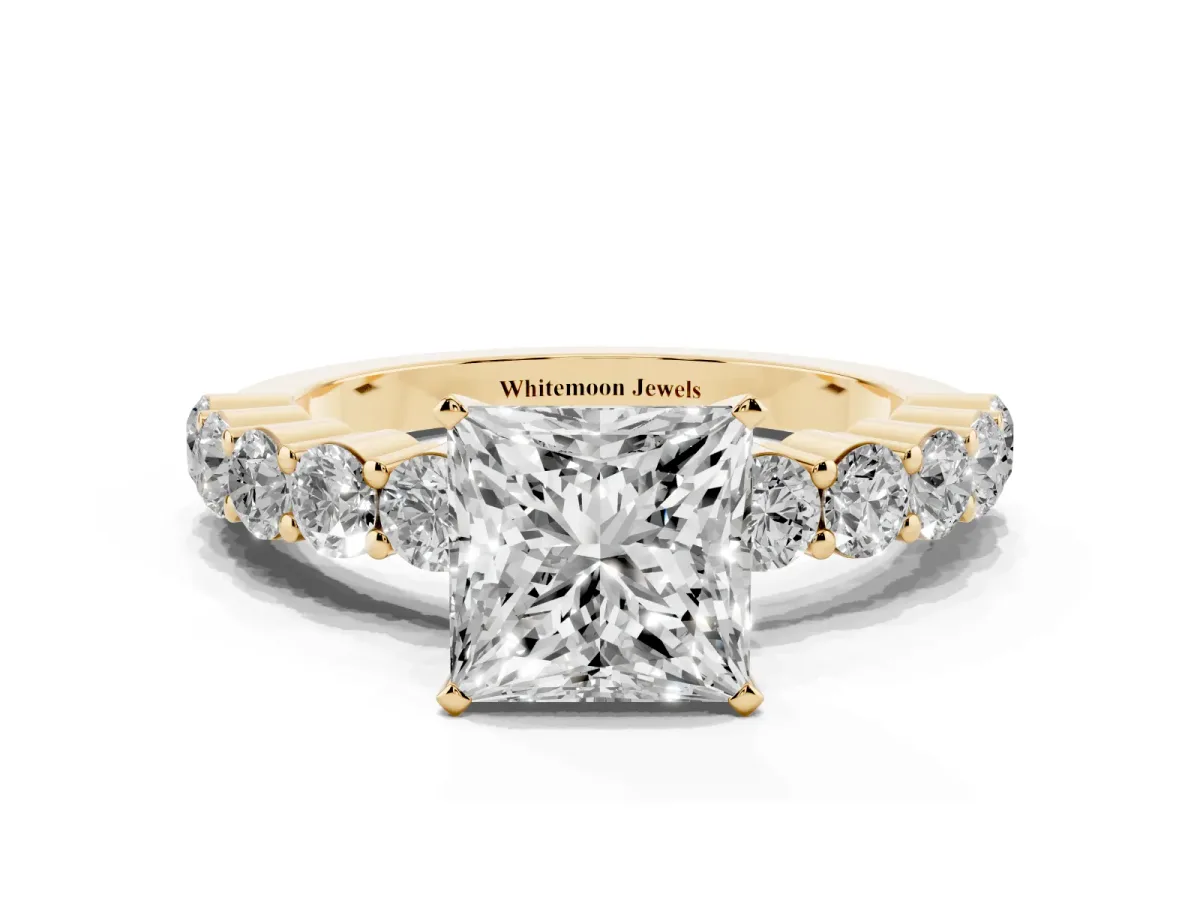 Princess Cut Diamond Solitaire Ring with Shared Prong Round Side Stones Yellow gold