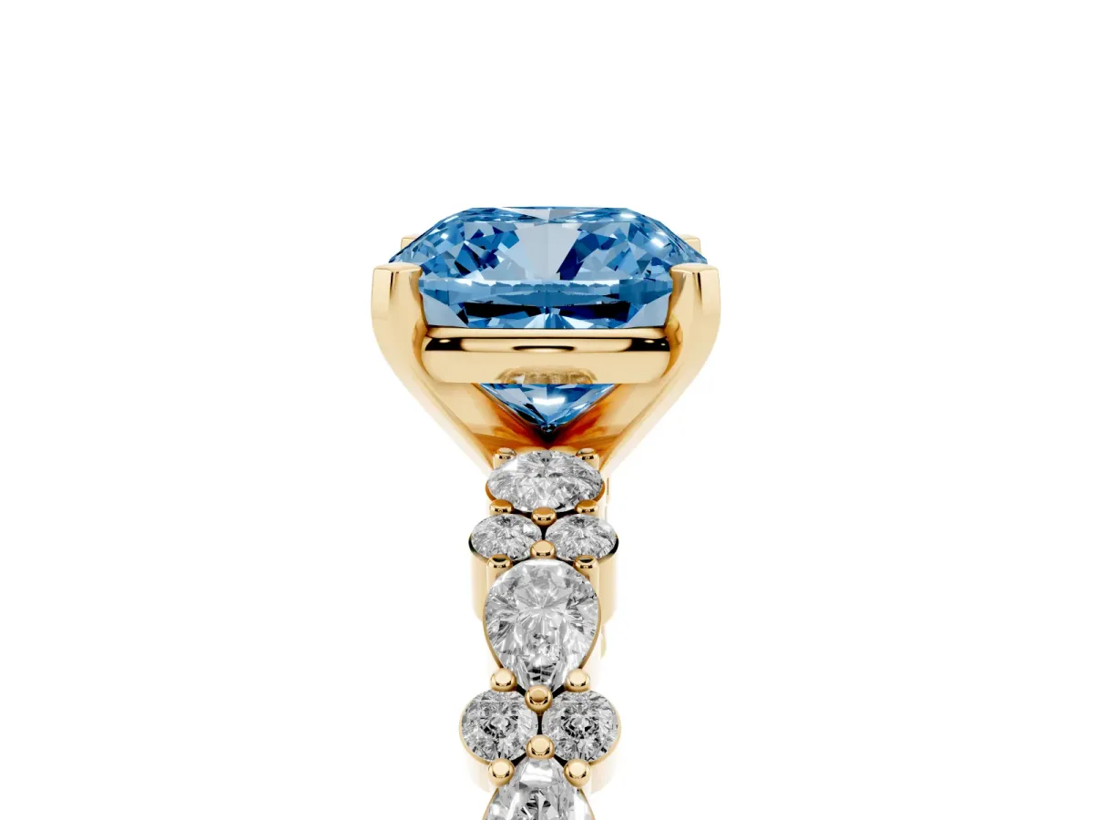 Fancy Blue Cushion Cut Diamond Side Stone Solitaire Ring with Round and Four-Prong Setting Yellow gold