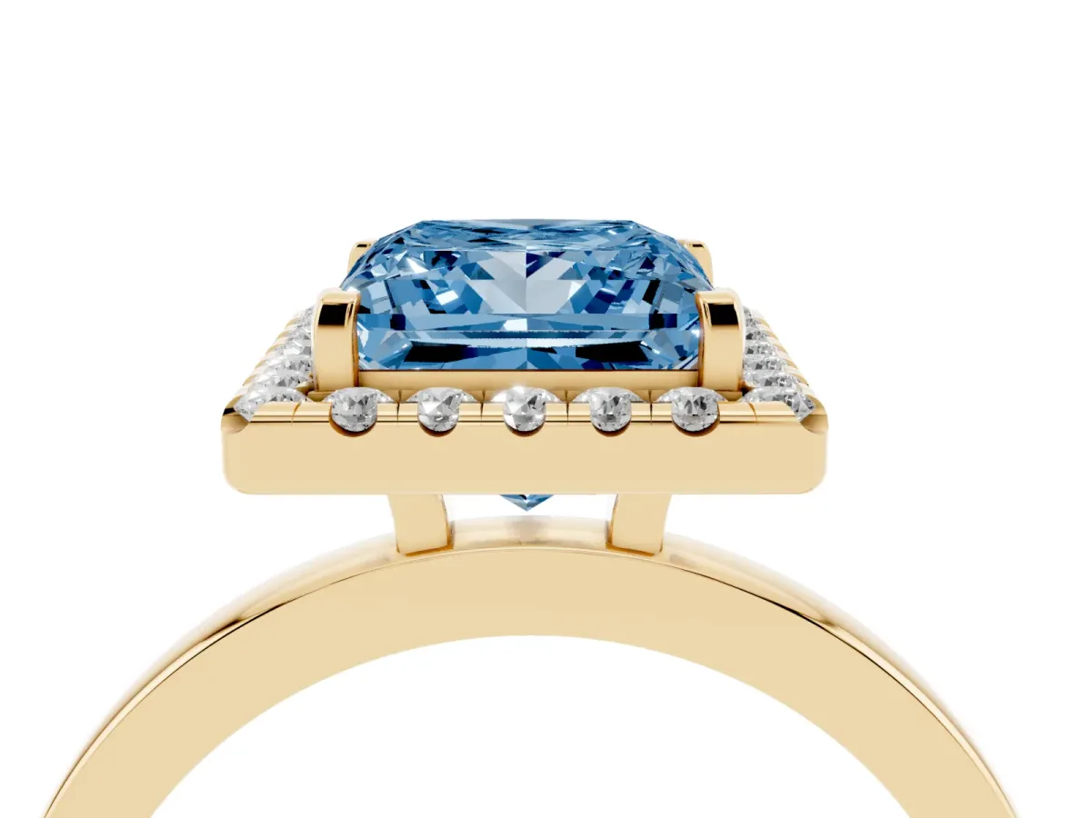 Fancy Blue Princess Cut Halo Diamond Solitaire with Pavé Band and Four-Prong Setting Yellow gold