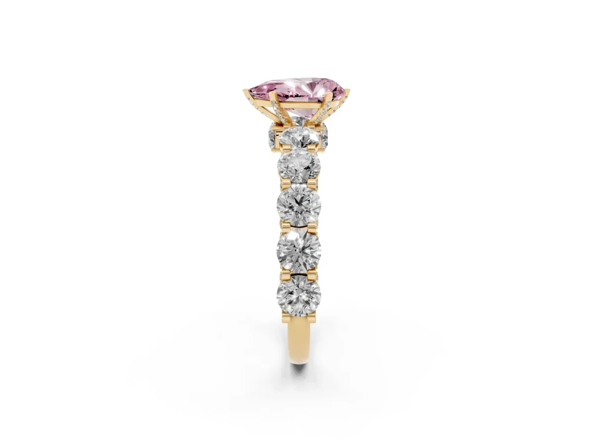 Fancy Pink Pear Cut Diamond Side Stone Engagement Ring with Four-Prong Setting Yellow gold