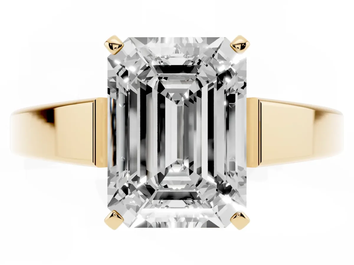 Emerald Cut Solitaire Engagement Ring with Four-Prong Setting and Tapered Band Yellow gold