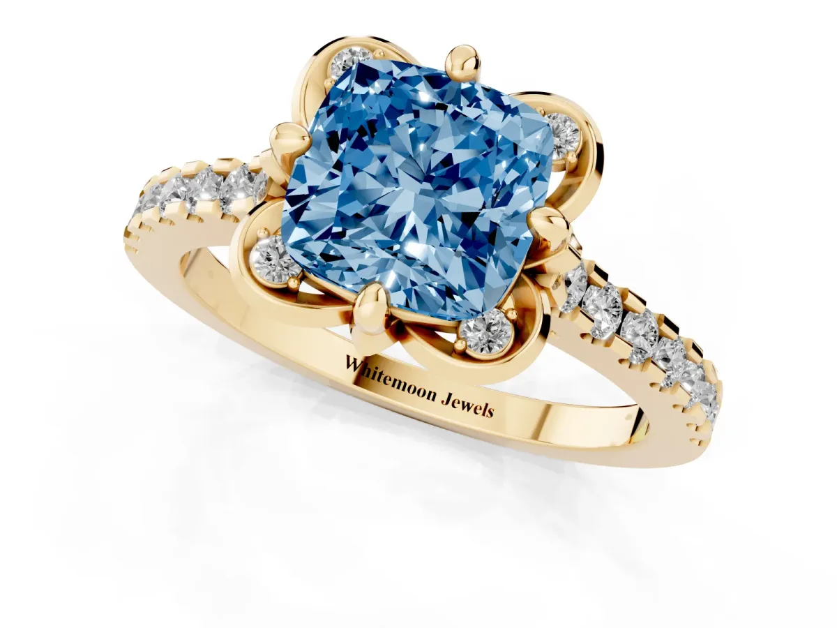 Fancy Blue Cushion Cut Diamond Ring with Pavé Band and Floral Prong Setting Yellow gold