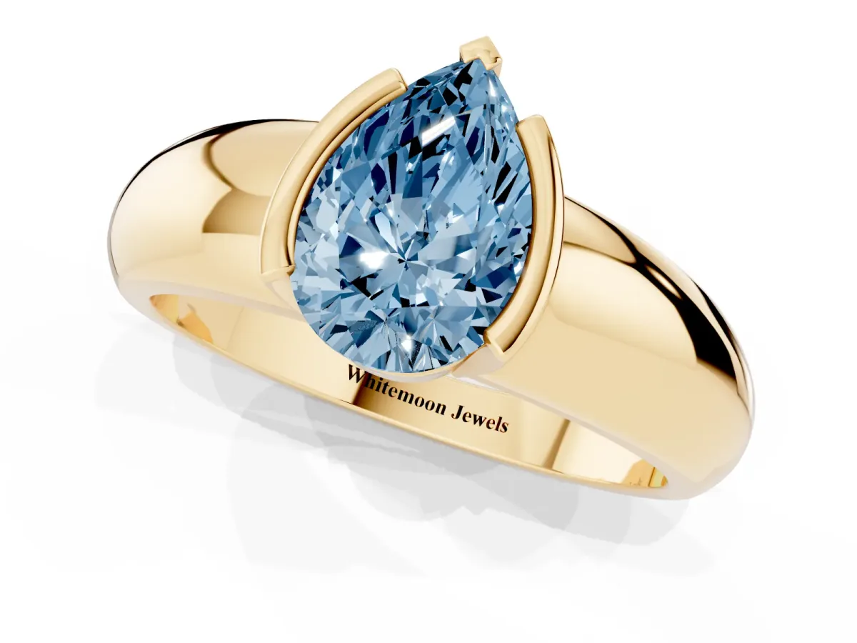 Fancy Blue Pear Cut Solitaire Tension Set Diamond Ring with Wide Band Yellow gold