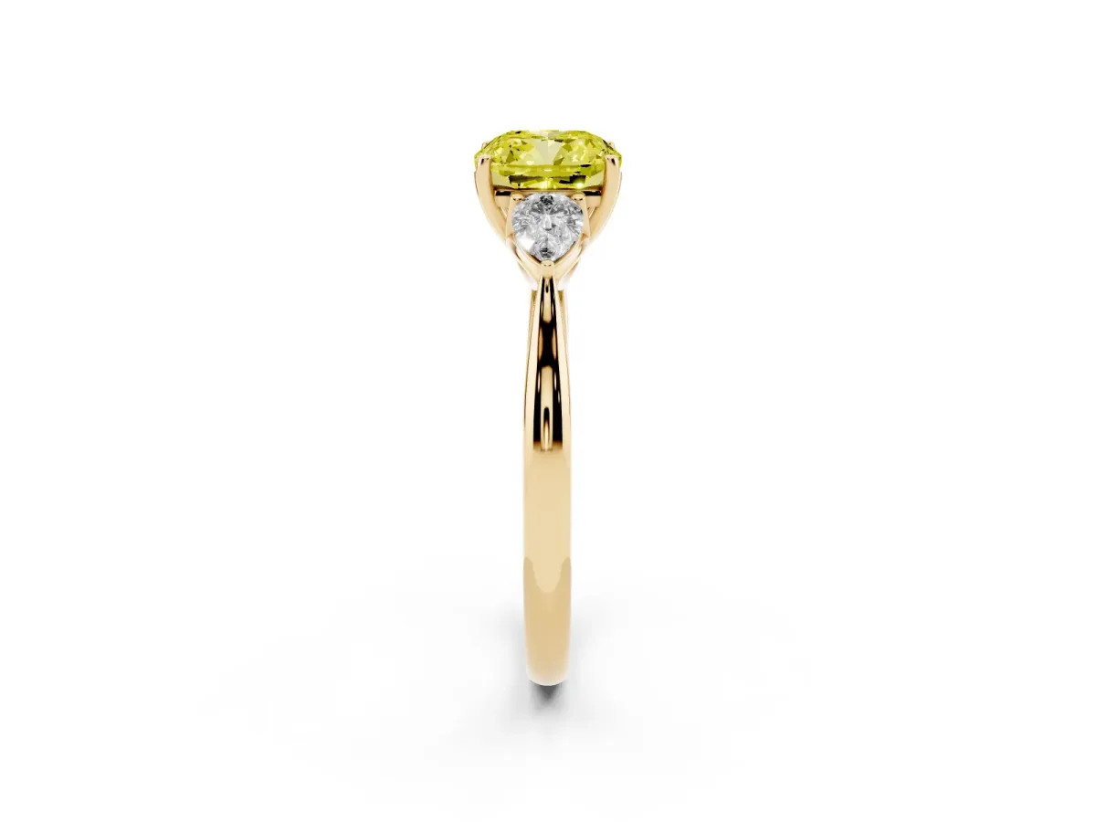 Fancy Yellow Three-Stone Cushion Cut Diamond Ring with Pear Side Stones in Four-Prong Setting Yellow gold