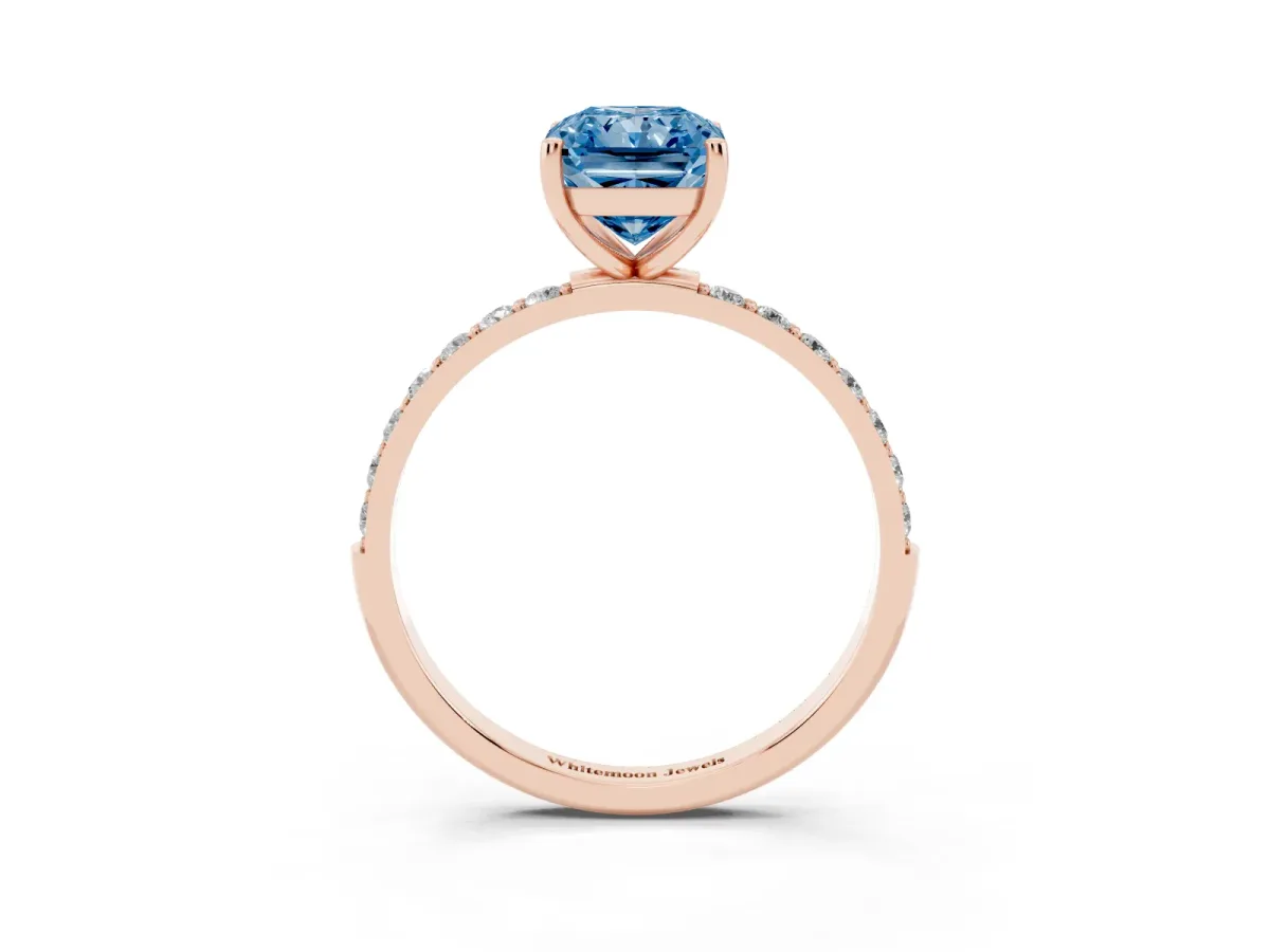 Fancy Blue Radiant Cut Diamond Solitaire Ring with Round Pavé Shoulders and Prong Setting Rose gold