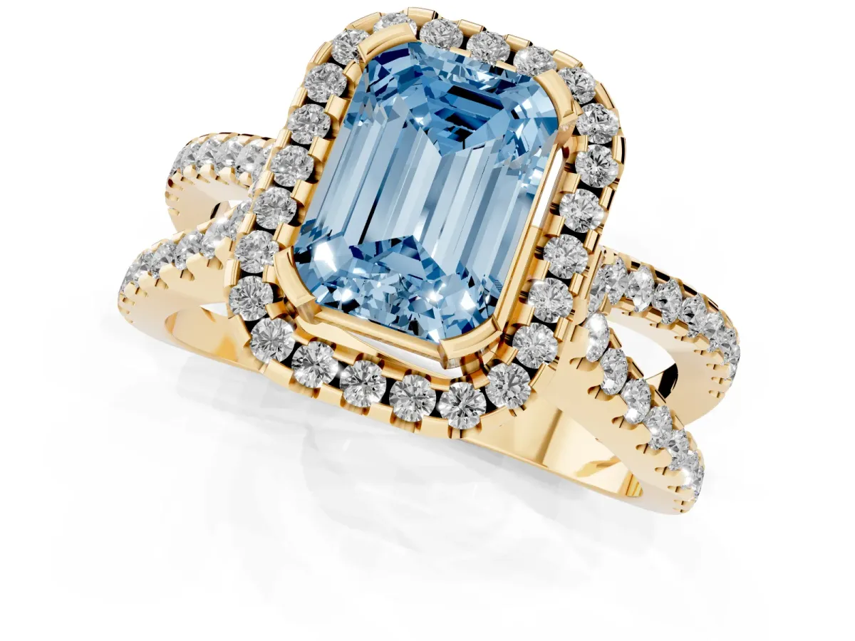 Fancy Blue Emerald Cut Diamond Halo Ring with Split Shank Pavé Band and Prong Setting Yellow gold