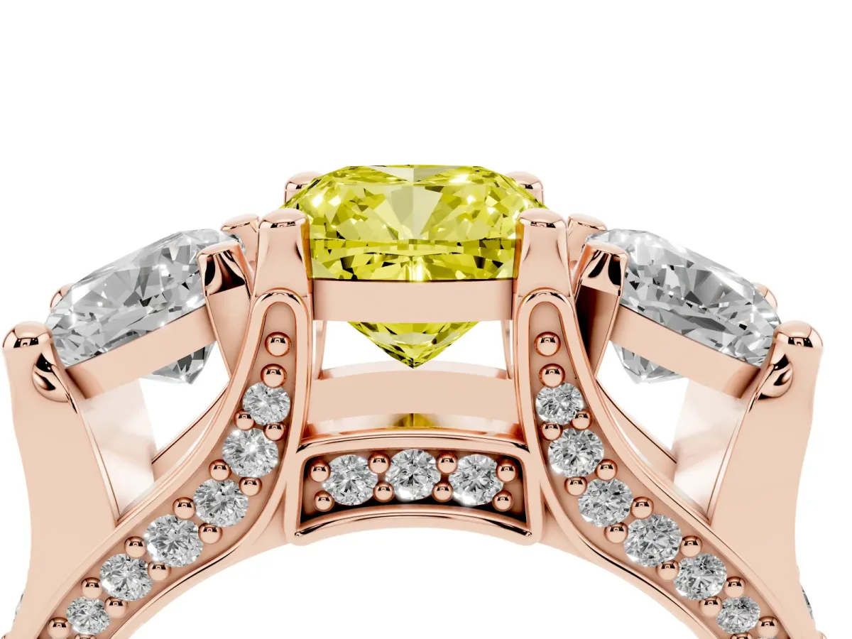 Fancy Yellow Cushion Cut Diamond Three-Stone Ring with Channel Set Band and Four-Prong Setting Rose gold