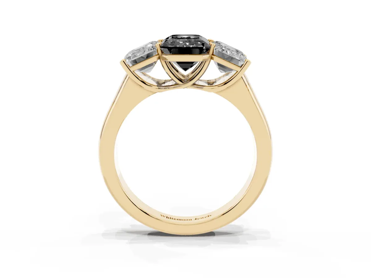 Fancy Black Emerald Cut Three-Stone Diamond Ring with Prong Setting on a Classic Band Yellow gold