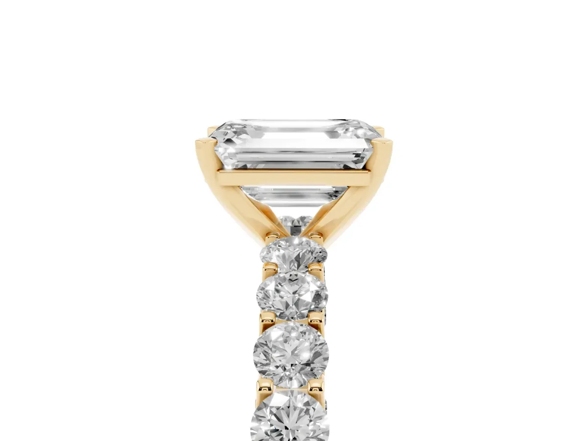Emerald Cut Diamond Solitaire Ring with Shared Prong Pavé Band and Four-Prong Setting Yellow gold
