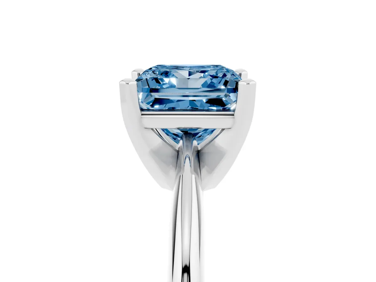 Fancy Blue Princess Cut Cut Solitaire Ring with Four-Prong Setting on a Classic Band Silver