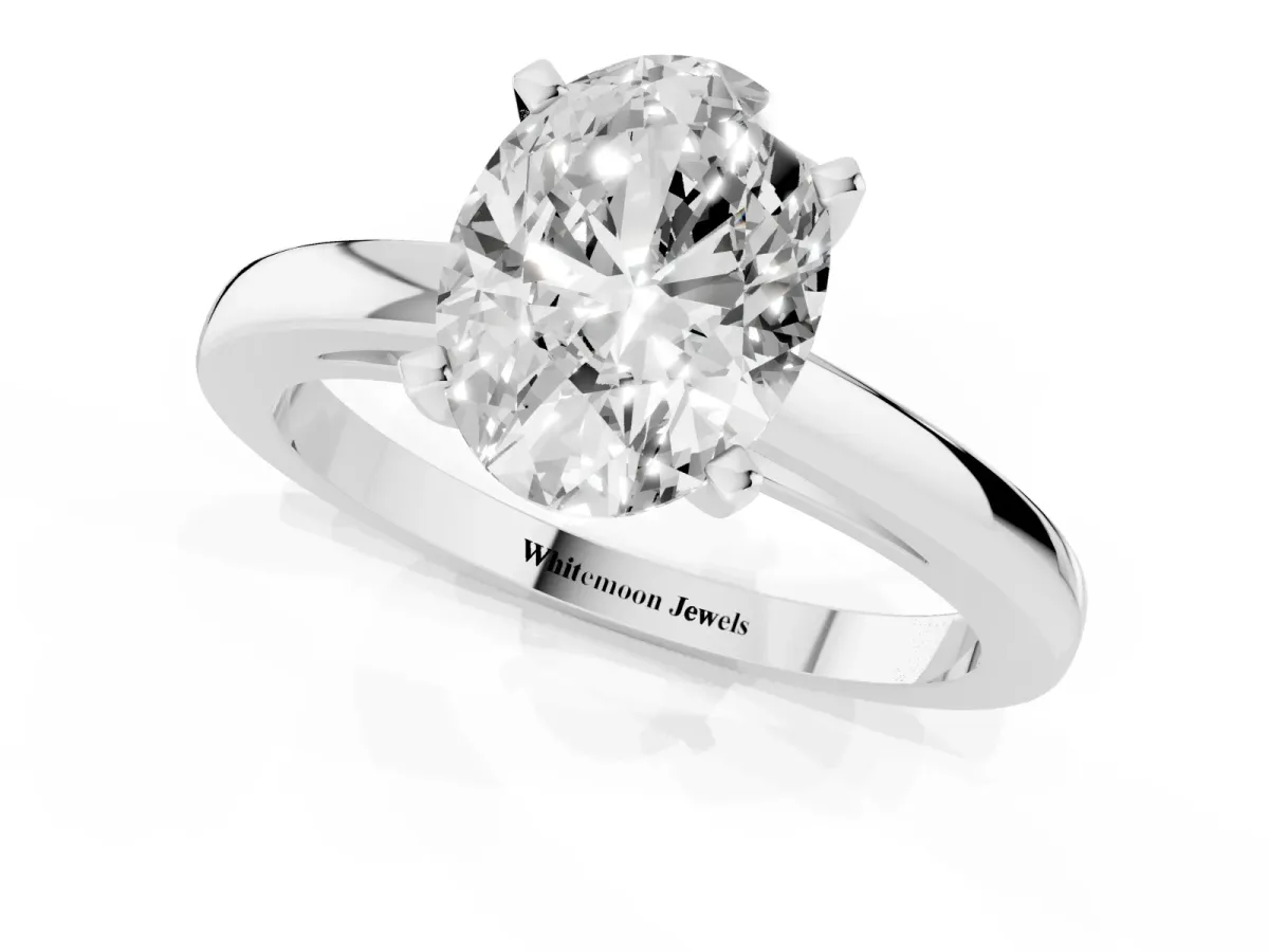 Oval Cut Solitaire Diamond Engagement Ring with Four-Prong Setting on a Classic Band Silver