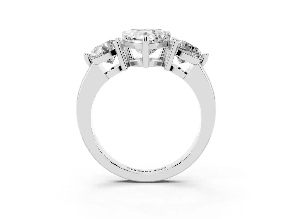 Three-Stone Heart Cut Brilliant Cut Solitaire Ring with Prong Setting on a Classic Band Silver
