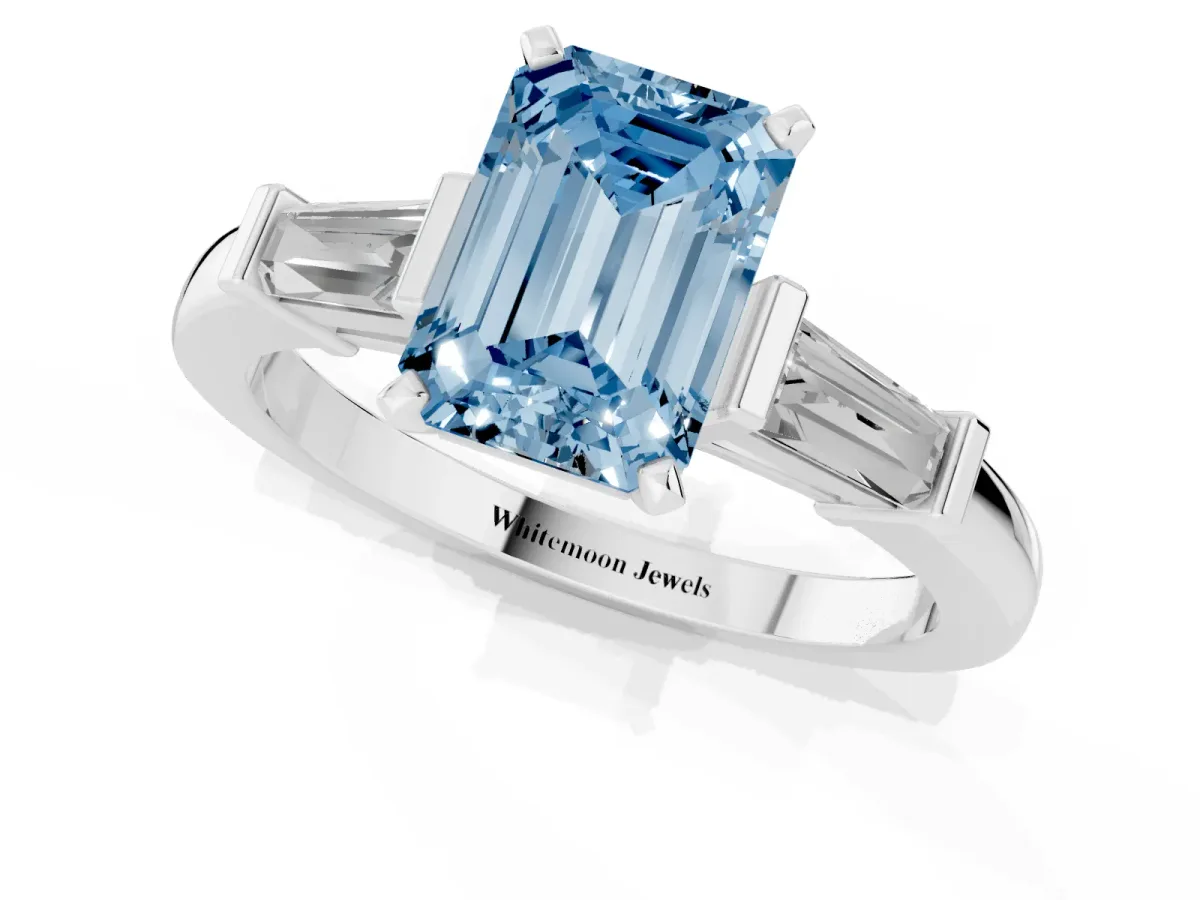 Fancy Blue Emerald Cut Cut Diamond Solitaire Ring with Tapered Baguette Accents and Four-Prong Setting Silver