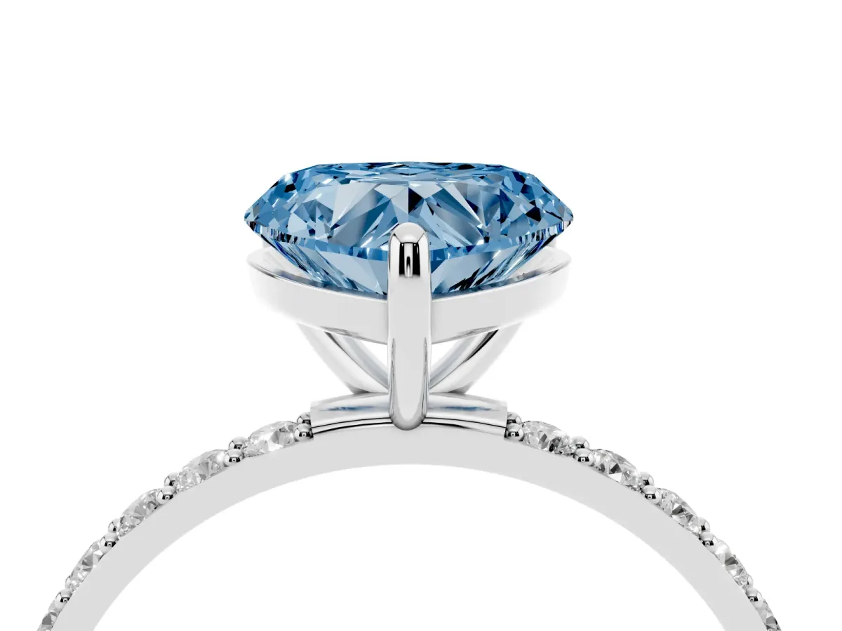 Fancy Blue Heart Cut Diamond Solitaire Ring with Round Pavé Band and Prong Setting Silver