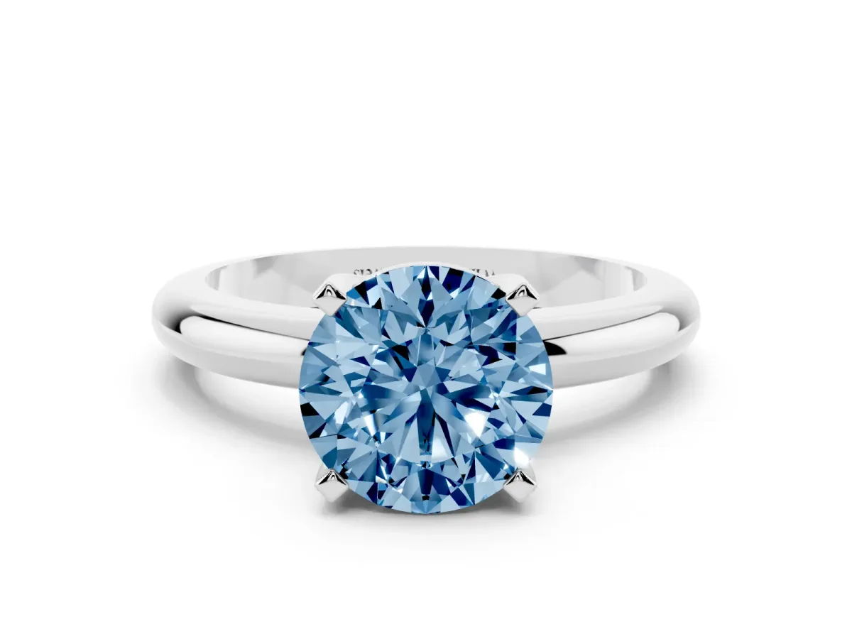 Fancy Blue Round Cut Diamond Solitaire Engagement Ring with Round Band and Four-Prong Setting Silver