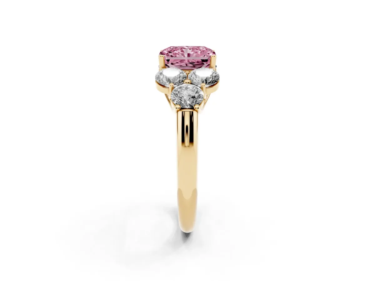Fancy Pink Radiant Cut Cut Diamond Cluster Ring with Round Accent Stones and Prong Setting on a Classic Band Yellow gold