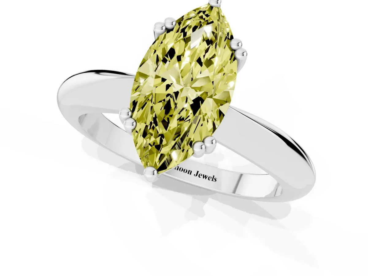 Fancy Yellow Marquise Cut Cut Solitaire Engagement Ring with Tapered Band and Four-Prong Setting White gold