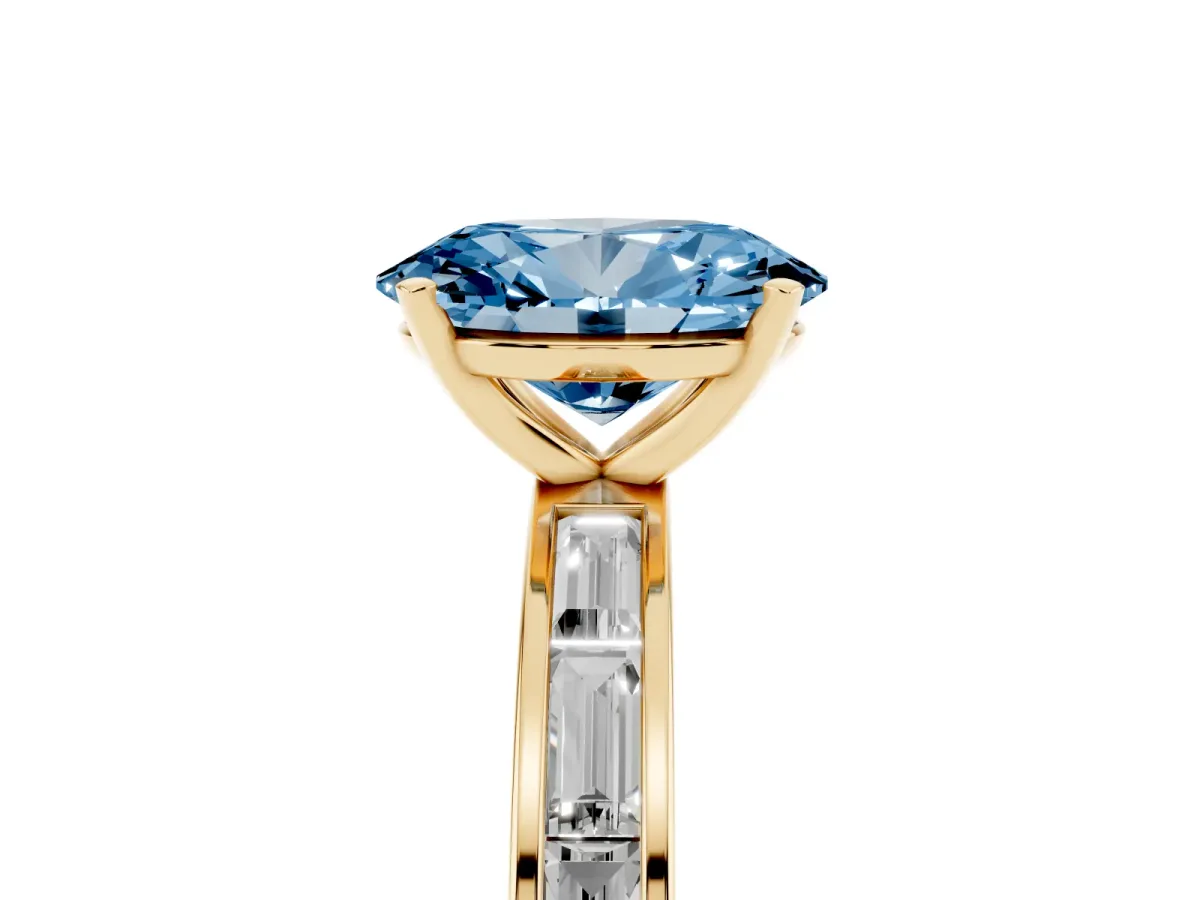 Fancy Blue Oval Cut Solitaire Diamond Ring with Channel-Set Baguette Band and Four-Prong Setting Yellow gold