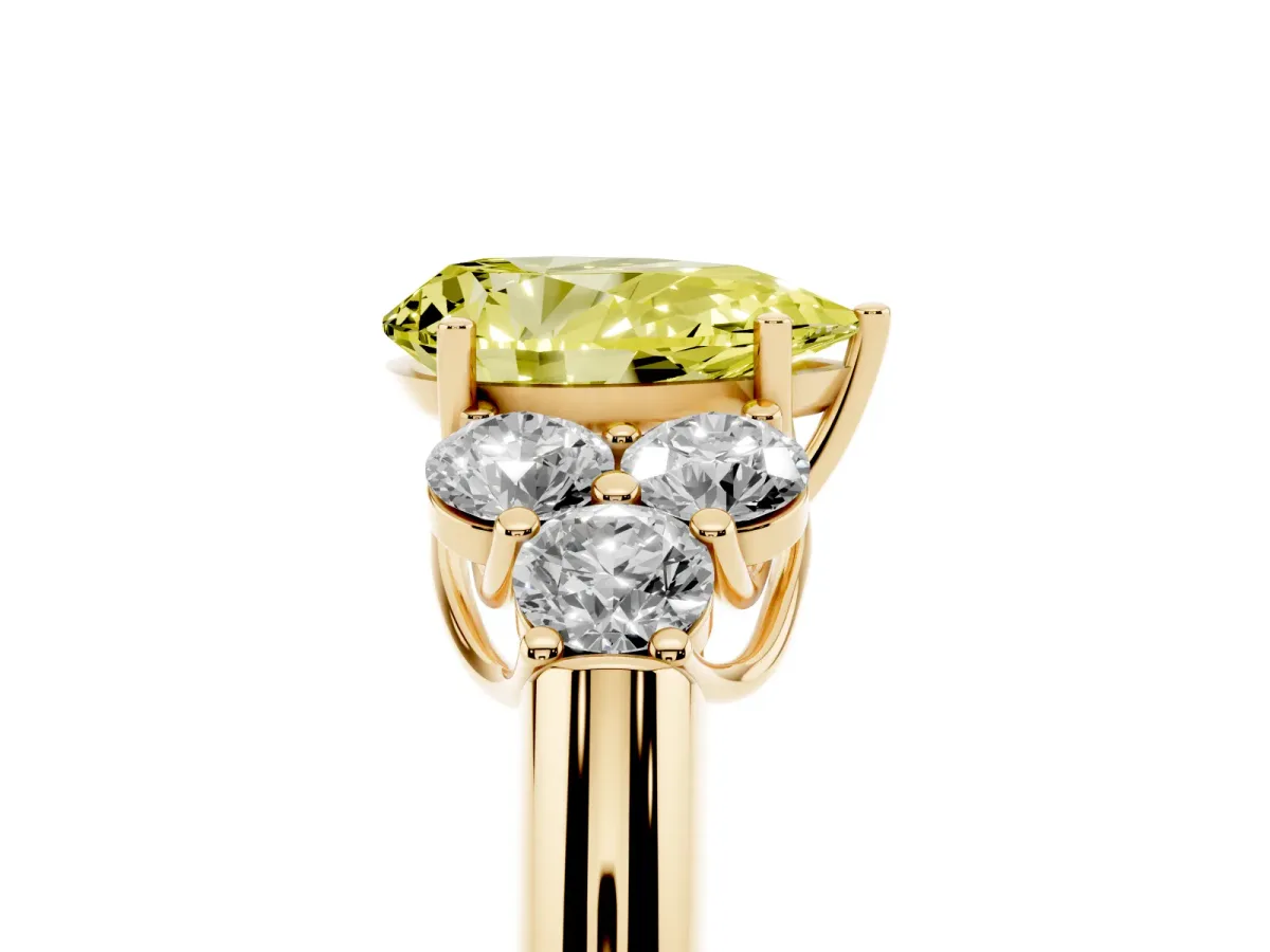Fancy Yellow Pear Cut Cut Diamond Cluster Ring with Round Accent Stones and Prong Setting on a Classic Band Yellow gold