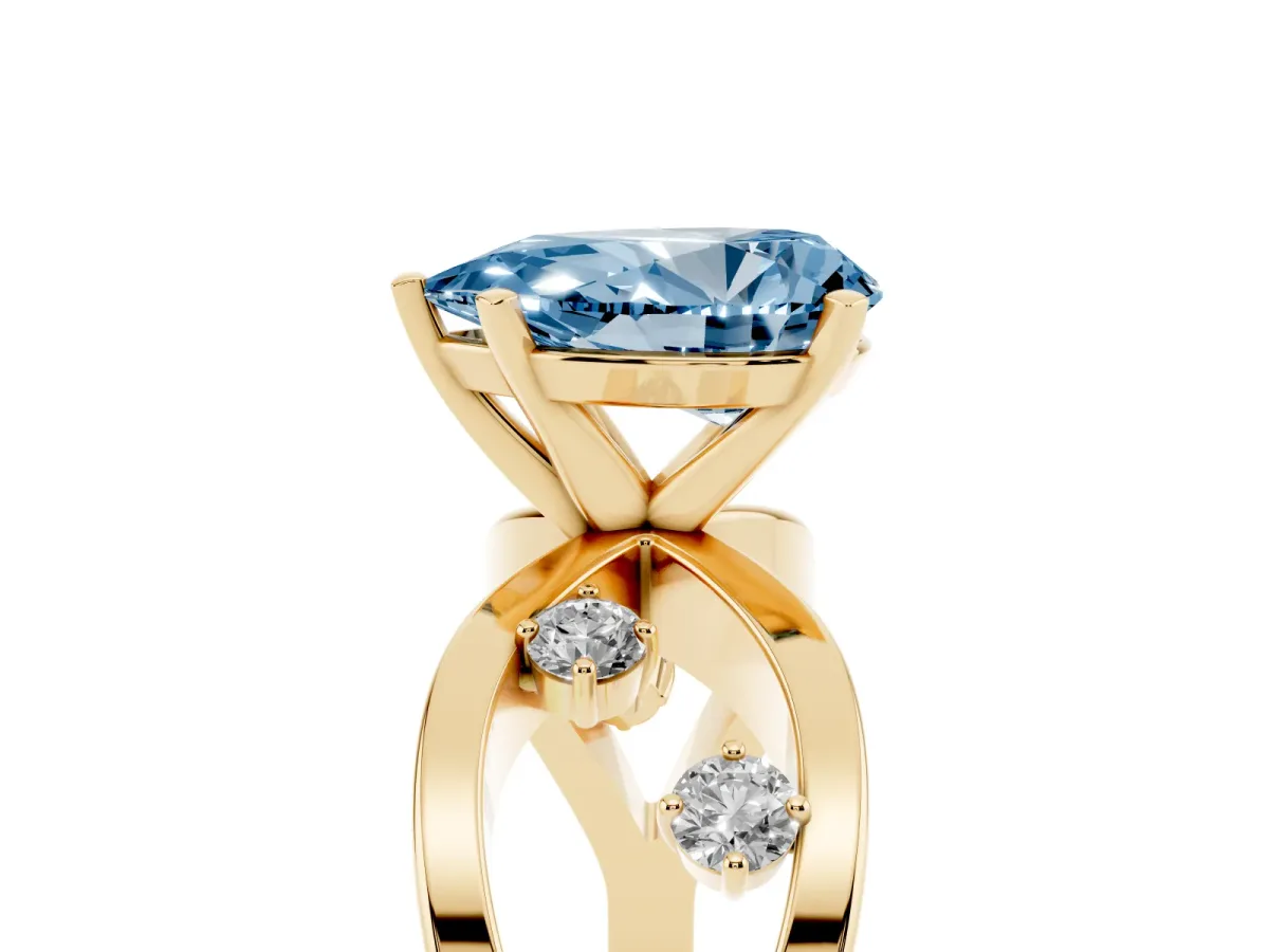 Fancy Blue Pear Cut Cut Solitaire Diamond with Side Stones on Criss-Cross Band and Four-Prong Setting Yellow gold