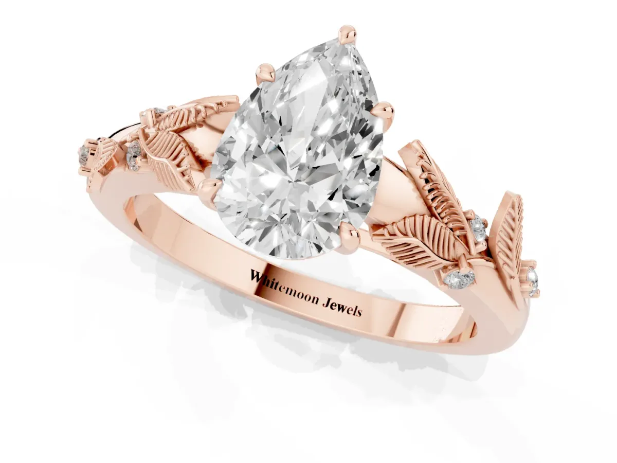 Pear Cut Diamond Solitaire Ring with Leaf Motif Band and Four-Prong Setting Rose gold
