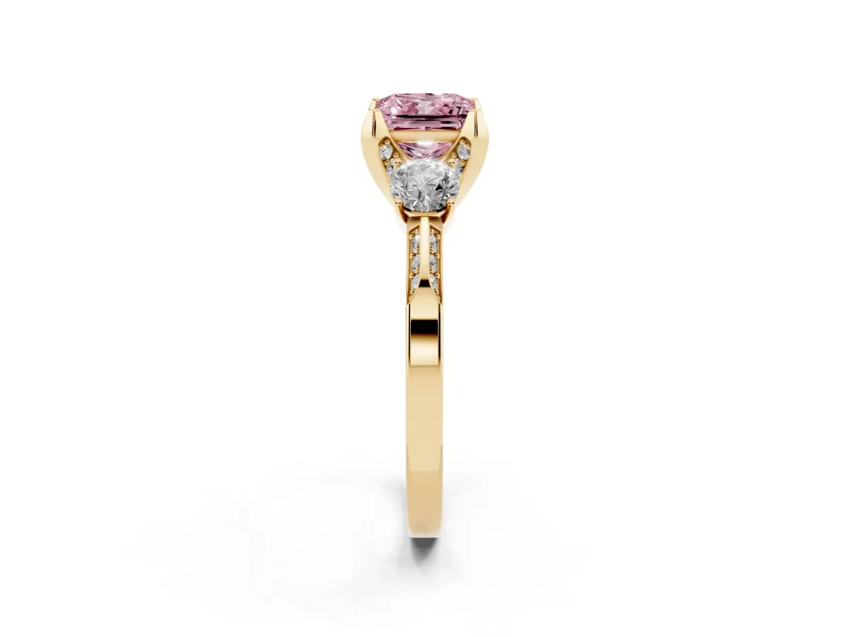 Fancy Pink Princess Cut Brilliant Three-Stone Diamond Ring with Pavé Band and Four-Prong Setting Yellow gold